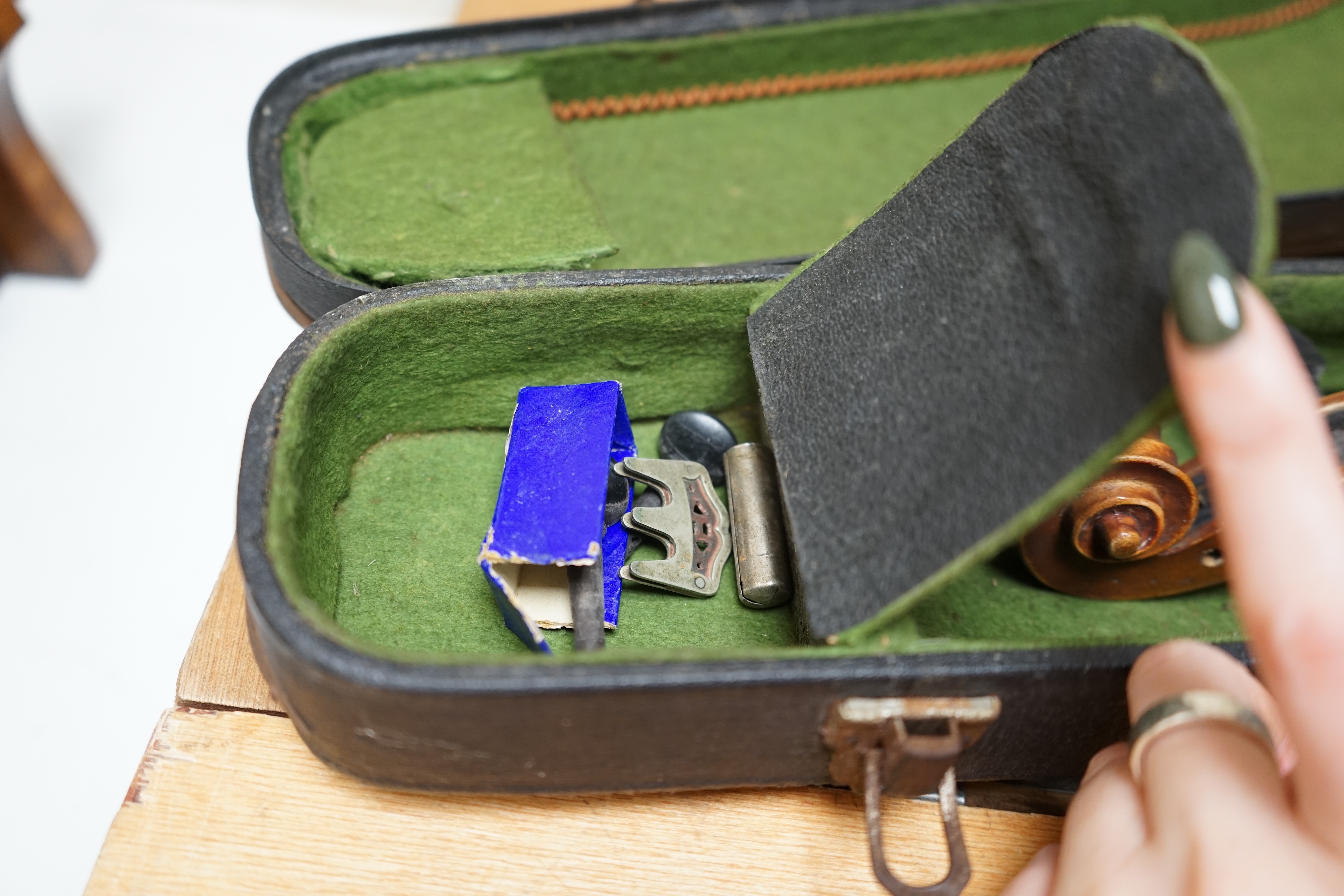 Early 20th century ¾ size violin, unlabelled, cased, together with a violin table, back and scroll. Condition - fair